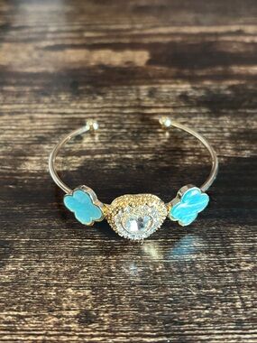 Gold Tone Cuff Bracelet with Turquoise Clover Enamel Heart Shape Crystal Center